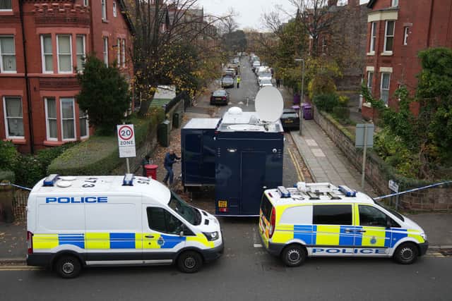 Police cars block the road as a control centre is set up in Rutland Avenue after properties were raided by armed officers on 15 November (Photo: Christopher Furlong/Getty Images)