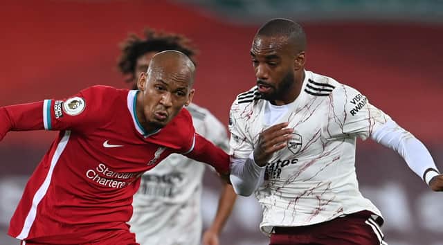 Fabinho battles battles for possession with Alexandre Lacazette  during Liverpool’s clash with Arsenal at Anfield last season. Picture: aurence Griffiths/Getty Images