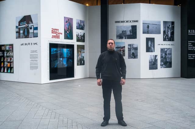 Sam outside his exhibition at the Open Eye Gallery. Image: Sam Batley 