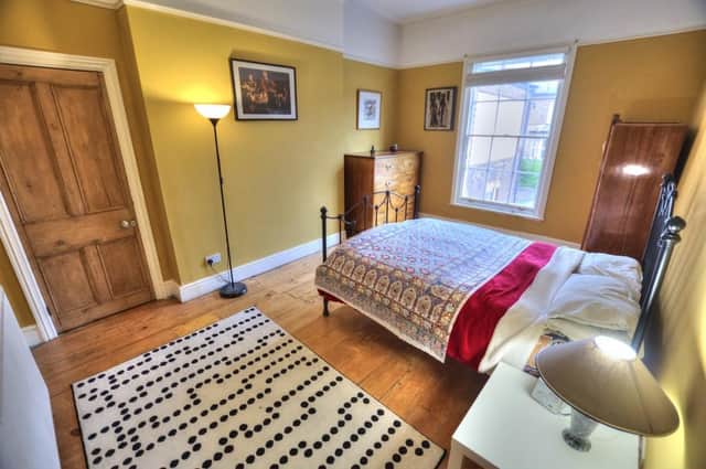 Spacious bedroom with wooden floors. Image: Rightmove/Michael Moon 