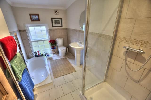 Sunken bath and separate shower. Image: Rightmove/Michael Moon 