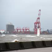 People out walking near the River Mersey during Storm Ciara in 2020.