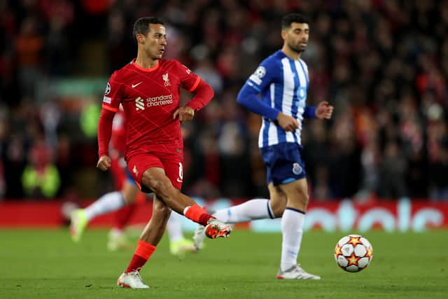  Thiago Alcantara of Liverpool passes the ball during the UEFA Champions League group B match between Liverpool FC and FC Porto at Anfield on November 24, 2021 in Liverpool, England. (Photo by Clive Brunskill/Getty Images)