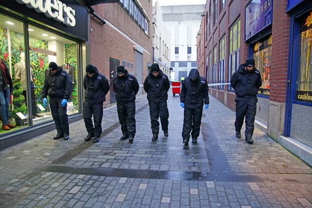 Police conduct a search near the scene in Liverpool city centre where 12-year-old Ava White died following an assault.