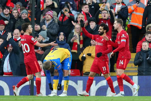 Diogo Jota celebrates scoring his second goal with Mo Salah and Jordan Henderson. Picture: Alex Livesey/Getty Images