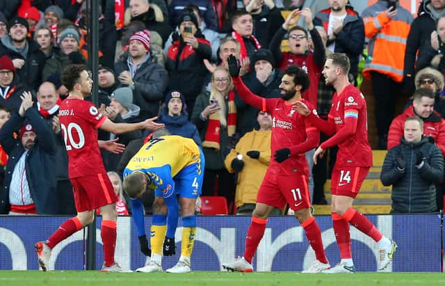 Diogo Jota celebrates scoring his second goal with Mo Salah and Jordan Henderson. Picture: Alex Livesey/Getty Images