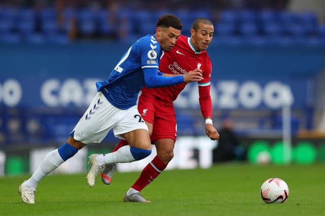 Everton’s Ben Godfrey battles with Liverpool’s Thiago during last season’s Merseyside derby at Goodison. Picture: CATHERINE IVILL/POOL/AFP via Getty Images