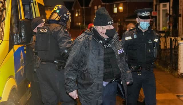 Boris Johnson joins a police raid in Liverpool. Photo: Christopher Furlong/Getty Images