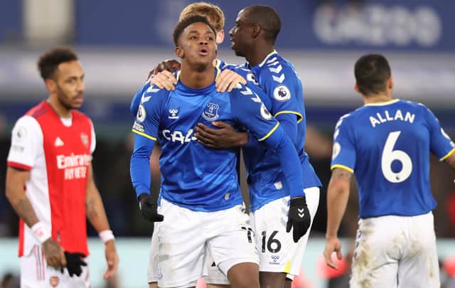 Demarai Gray of Everton celebrates with teammates Anthony Gordon and Abdoulaye Doucoure. Photo: Naomi Baker/Getty Images