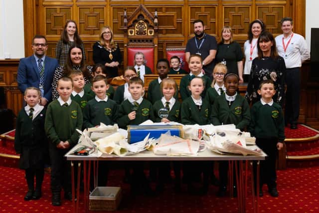 Pupils and staff time at the opening of the time capsule. Photo Credit: Jess Hornby