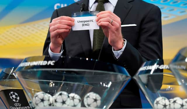 Liverpool are pulled out of the bowl during a previous Champions League draw. Photo: FABRICE COFFRINI/AFP via Getty Images