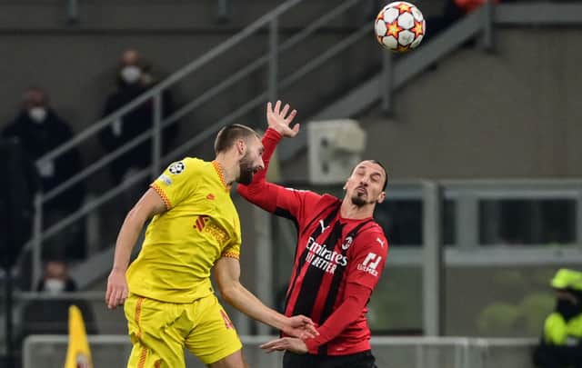Nathaniel Phillips duels with AC Milan forward Zlatan Ibrahimovic. Photo: MIGUEL MEDINA/AFP via Getty Images