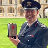Chief Fire Officer Phil Garrigan with his OBE.