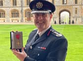 Chief Fire Officer Phil Garrigan with his OBE.