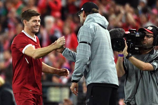 Liverpool legend Steven Gerrard shakes hands with Liverpool manager Jurgen Klopp