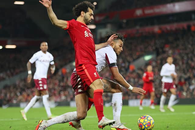 Mohamed Salah of Liverpool and Aston Villa’s Tyrone Mings clash in the box, leading to the match -winning penalty. Photo: Clive Brunskill/Getty Images