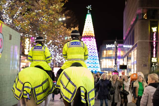 Calendar photo of Merseyside Mounted Police with Christmas shoppers. Image: Merseyside Police