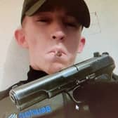 Gang member Rixhers Shehi poses with a handgun. Image: Merseyside Police