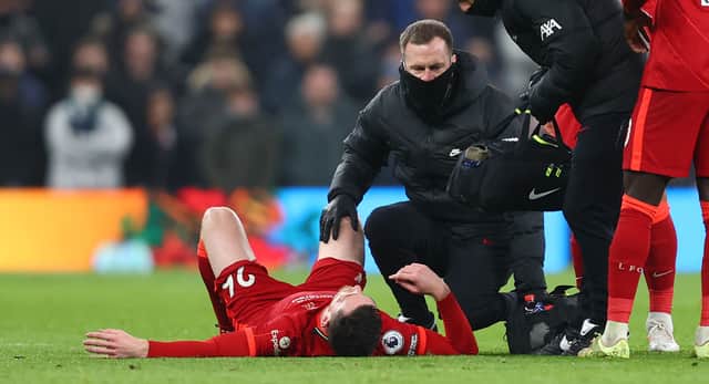 <p>Andy Robertson was on the receiving end of a high challenge from Harry Kane. Picture: Julian Finney/Getty Images</p>