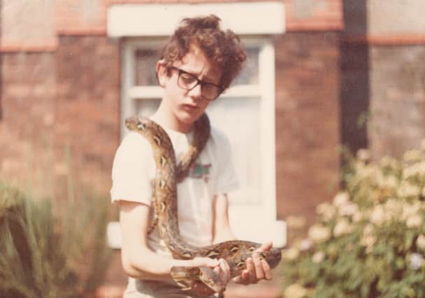 Paul Rowley as a young boy with a snake. Image: Paul Rowley