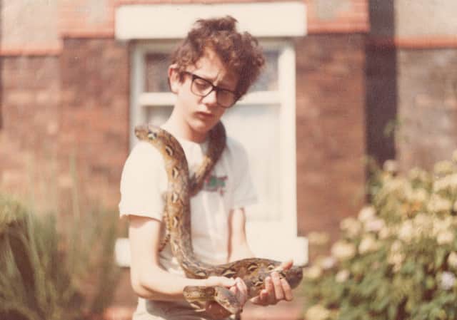 <p>Paul Rowley as a young boy with a snake. Image: Paul Rowley</p>