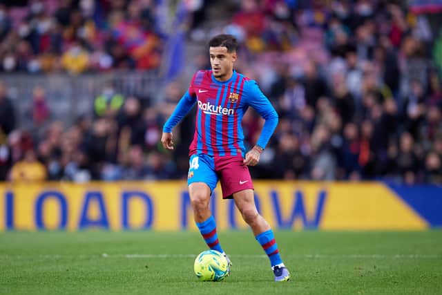 hilippe Coutinho of FC Barcelona runs with the ball during the La Liga Santander match between FC Barcelona and Real Betis at Camp Nou on December 04, 2021
