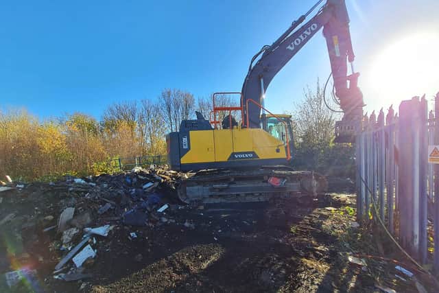 Fly-tipping being cleared away. Image: Network Rail 