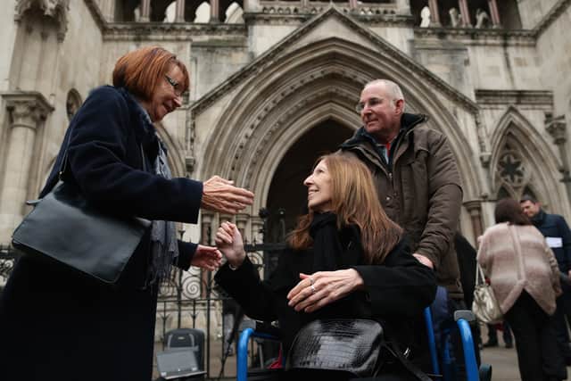 LONDON, UNITED KINGDOM - DECEMBER 19:  Anne Williams (C) who lost her son Kevin in the Hillsborough Disaster arrives at the High Court on December 19, 2012 in London, England. An application presented by the attorney general, Dominic Grieve to Lord Chief Justice, Lord Judge resulted in the quashing of the original accidental death verdict and an order for fresh inquests. The Hillsborough disaster occurred during the FA Cup semi-final tie between Liverpool and Nottingham Forest football clubs in April 1989 at the Hillsborough Stadium in Sheffield, which resulted in the deaths of 96 football fans.  (Photo by Dan Kitwood/Getty Images)