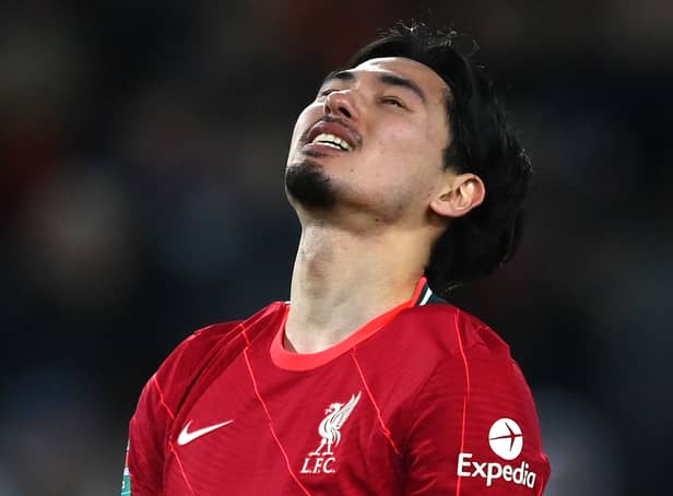 <p>Takumi Minamino of Liverpool reacts during the Carabao Cup Semi Final First Leg match between Liverpool and Arsenal at Anfield on January 13, 2022 in Liverpool, England. (Photo by Michael Regan/Getty Images</p>