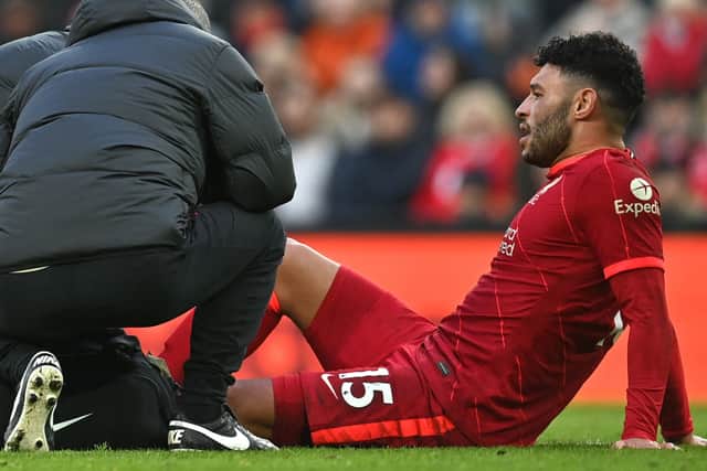 Alex Oxlade-Chamberlain receives treatment in Liverpool’s victory over Brentford. Picture: PAUL ELLIS/AFP via Getty Images