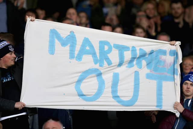 Everton fans raise a banner that says “Martinez out” in protest during Roberto Martinez’s time as manager. Picture: Chris Brunskill/Getty Images)