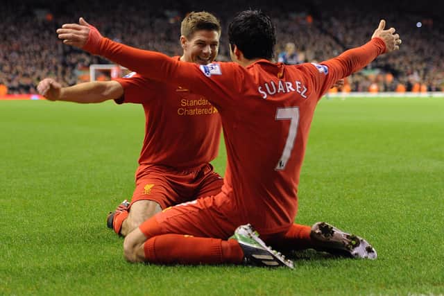 Gerrard, left, and Suarez celebrate in 2013