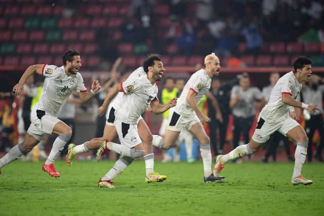 MOHAMED SALAH  of Egypt runs in celebration with his team mates (Photo by Visionhaus/Getty Images)