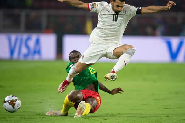 FEBRUARY 03: MOHAMED SALAH of Egypt and NOUHOU TOLO of Cameroon (Photo by Visionhaus/Getty Images)