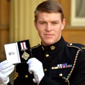 Corporal Josh Griffiths of the Mercian Regiment holds his Conspicuous Gallantry Cross. Photo: John Stillwell - WPA Pool/Getty Images