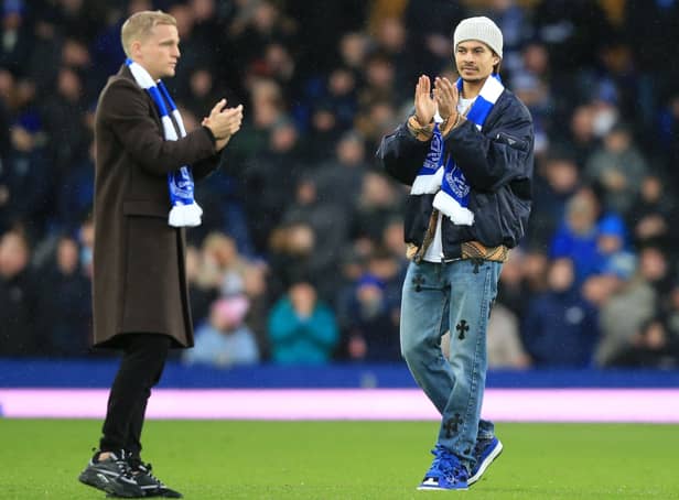 <p>New Everton signings Donny van de Beek and Dele Alli on the Goodison Park pitch. Picture: LINDSEY PARNABY/AFP via Getty Images</p>
