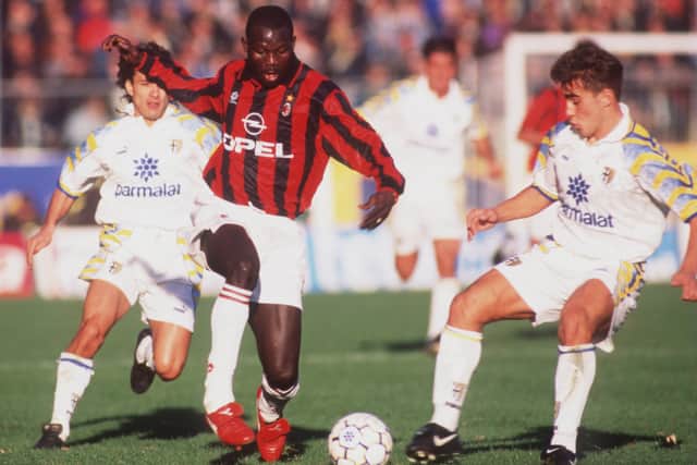 Weah, left, is widely regarded as one of the greatest footballers in the world