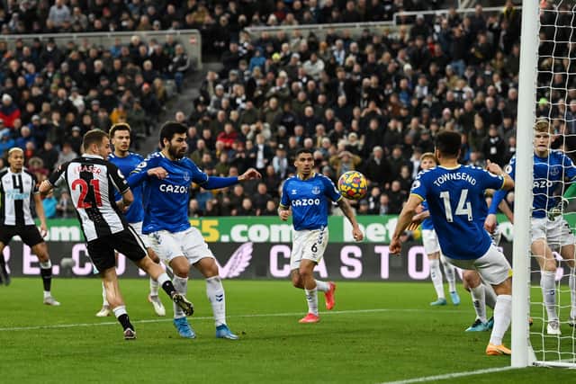 Ryan Fraser of Newcastle United scores their sides second goal during the Premier League match between Newcastle United and Everton at St. James Park on February 08, 2022 in Newcastle upon Tyne, England. (Photo by Stu Forster/Getty Images)