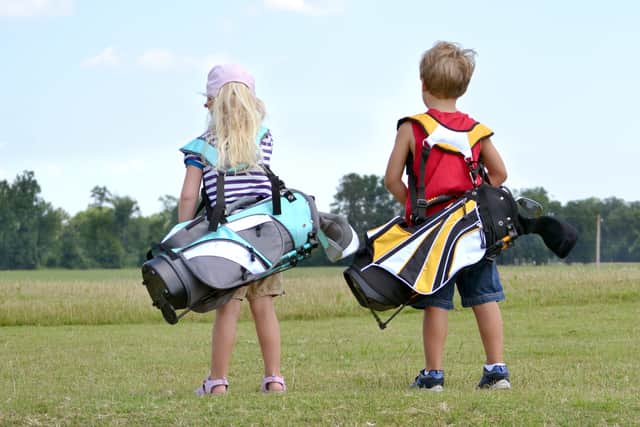 Kids playing golf. Image: Kimberly Reinick - stock.adobe