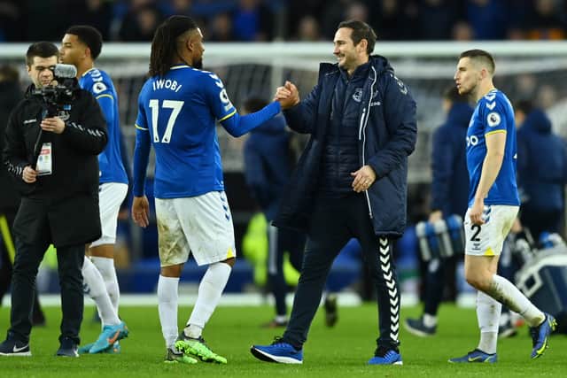 LIVERPOOL, ENGLAND - FEBRUARY 12: Frank Lampard, Manager of Everton and Alex Iwobi of Everton celebrate following their side’s victory in the Premier League match between Everton and Leeds United at Goodison Park on February 12, 2022 in Liverpool, England. (Photo by Gareth Copley/Getty Images)