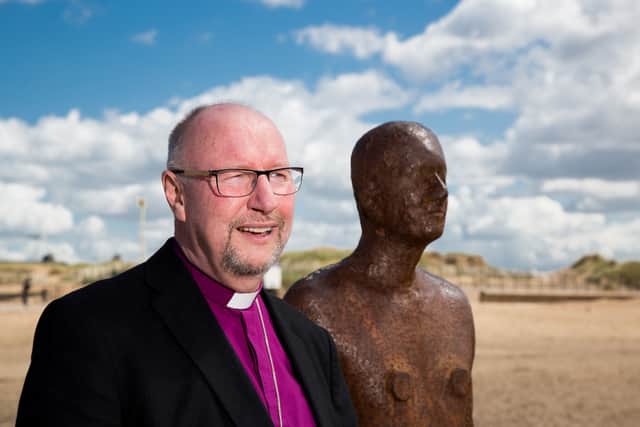Paul Bayes at Another Place by Antony Gormley. Photo:The Diocese of Liverpool