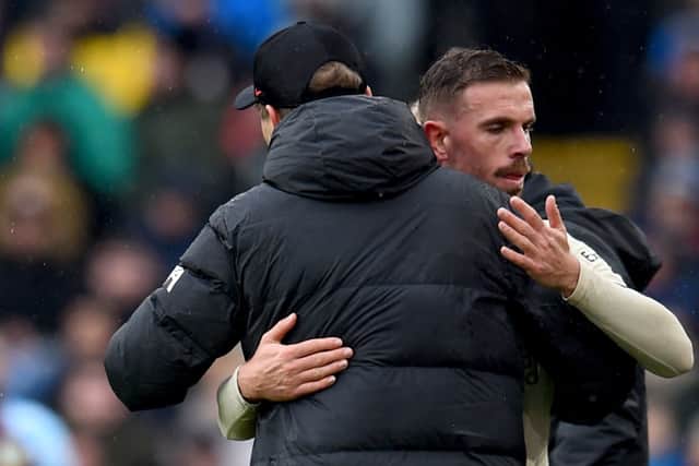 Jurgen Klopp embraces Jordan Henderson after he is withdrawn during Liverpool’s win at Burnley. Picture: Andrew Powell/Liverpool FC via Getty Images