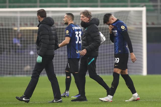 Inter forward Joaquin Correa walks off injured. Picture: Marco Luzzani/Getty Images