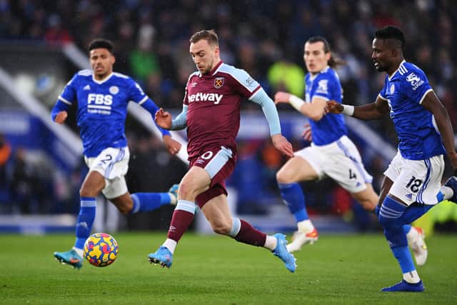 arrod Bowen of West Ham United runs with the ball before scoring their sides first goal during the Premier League match between Leicester City and West Ham United at The King Power Stadium on February 13, 2022