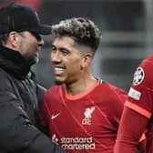 Roberto Firmino celebrates Liverpool’s victory at Inter Milan with Jurgen Klopp. Picture: FILIPPO MONTEFORTE/AFP via Getty Images