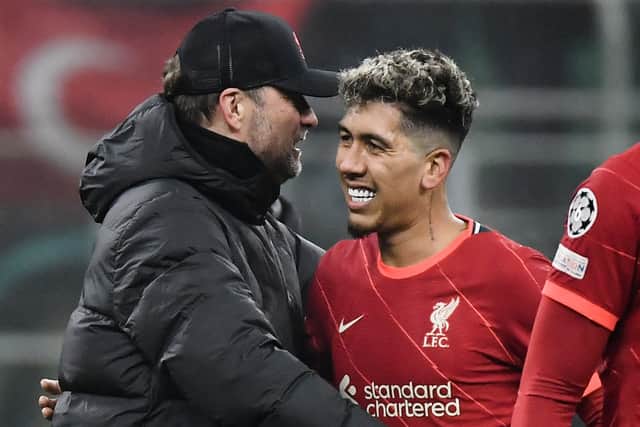 Roberto Firmino celebrates Liverpool’s victory at Inter Milan with Jurgen Klopp. Picture: FILIPPO MONTEFORTE/AFP via Getty Images