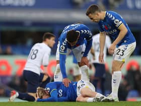 Everton’s Tom Davies down injured in the Tottenham Hotspur