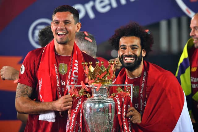 Mohamed Salah and Dejan Lovren with the Premier League trophy.