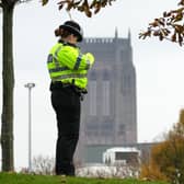 A Merseyside Police officer with Liverpool Cathedral in the background. Image: Christopher Furlong/Getty Images