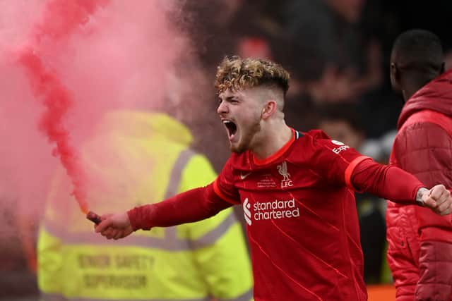 Harvey Elliott celebrates with a red flare after Liverpool’s Carabao Cup triumph. Picture: Michael Regan/Getty Images